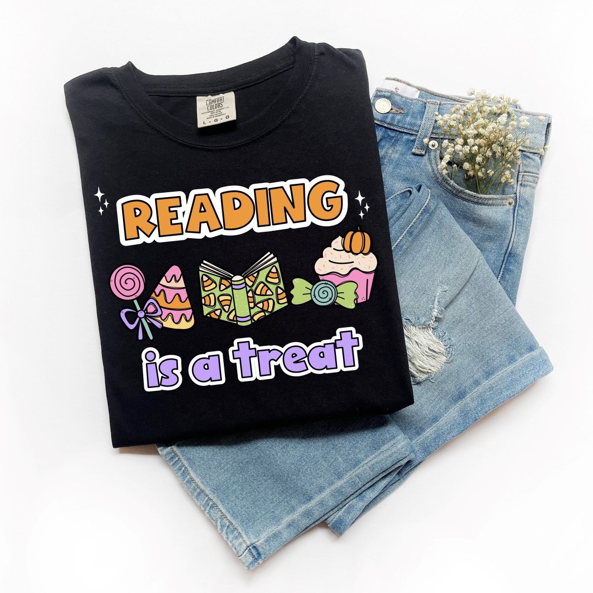 "Reading is a Treat" Halloween Teacher T-Shirt (Purple Text)