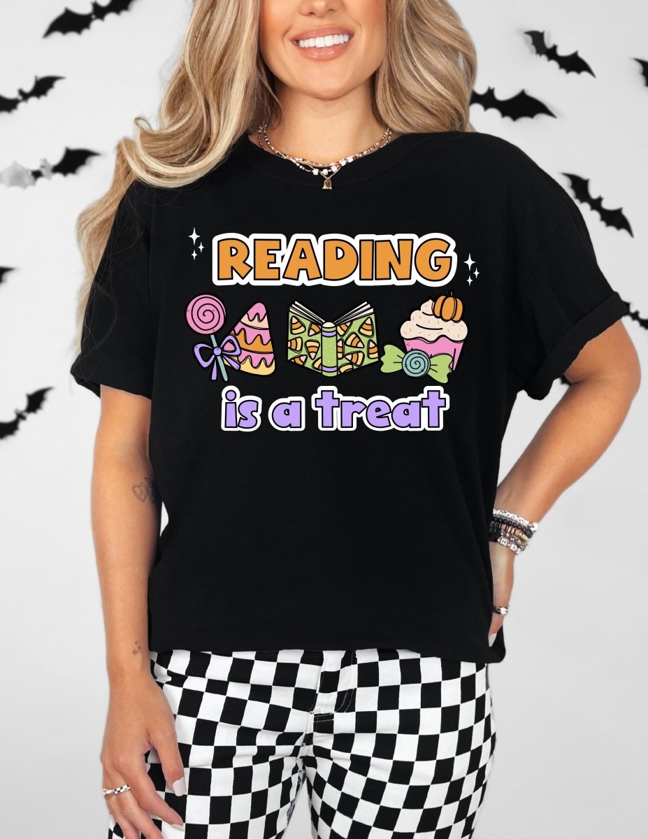 "Reading is a Treat" Halloween Teacher T-Shirt (Purple Text)